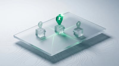 A frosted glass map slab with three small glass storefront blocks, one crowned by a glowing emerald location pin with light trails converging on it.